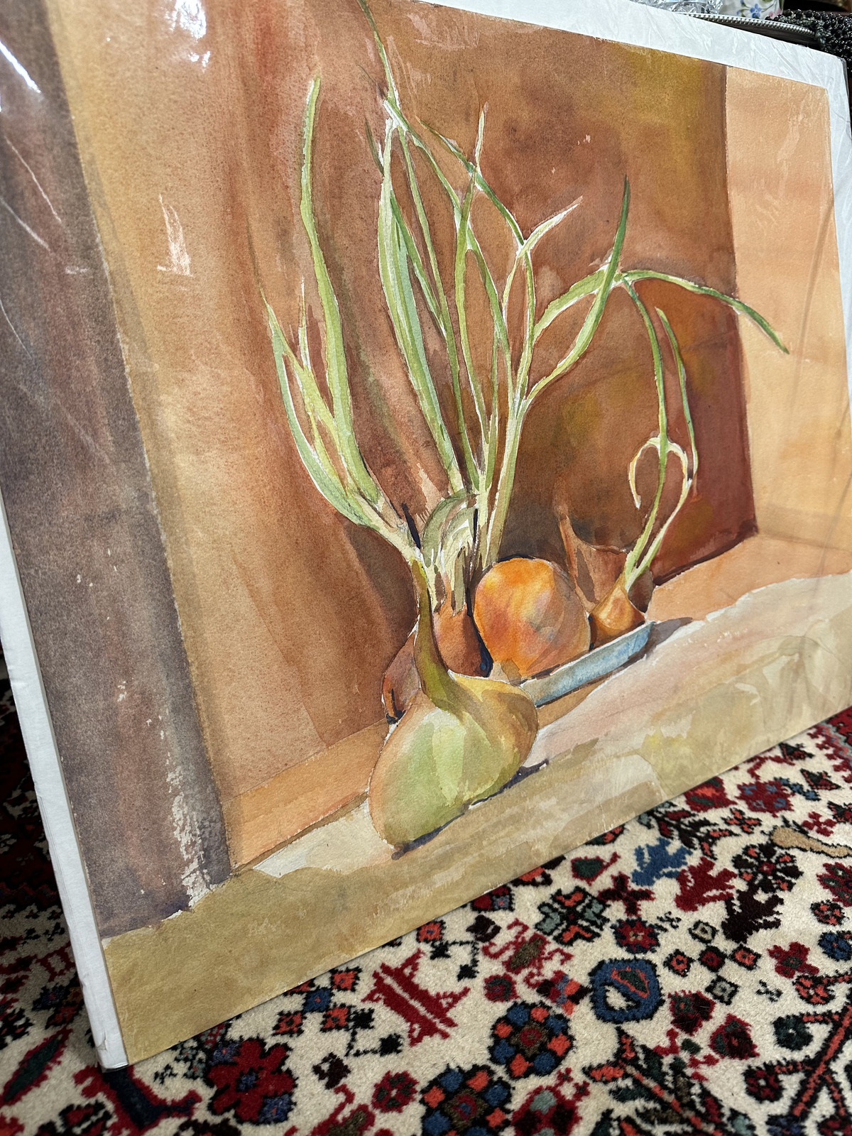 Framed still life artwork and decor inside Triangle Trading Post