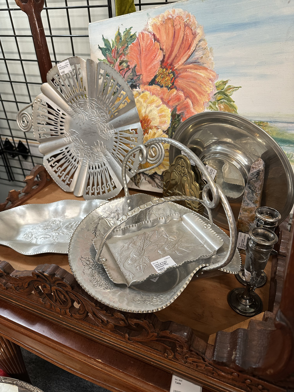Antique silver, tabletop pieces, and collected decor inside Triangle Trading Post