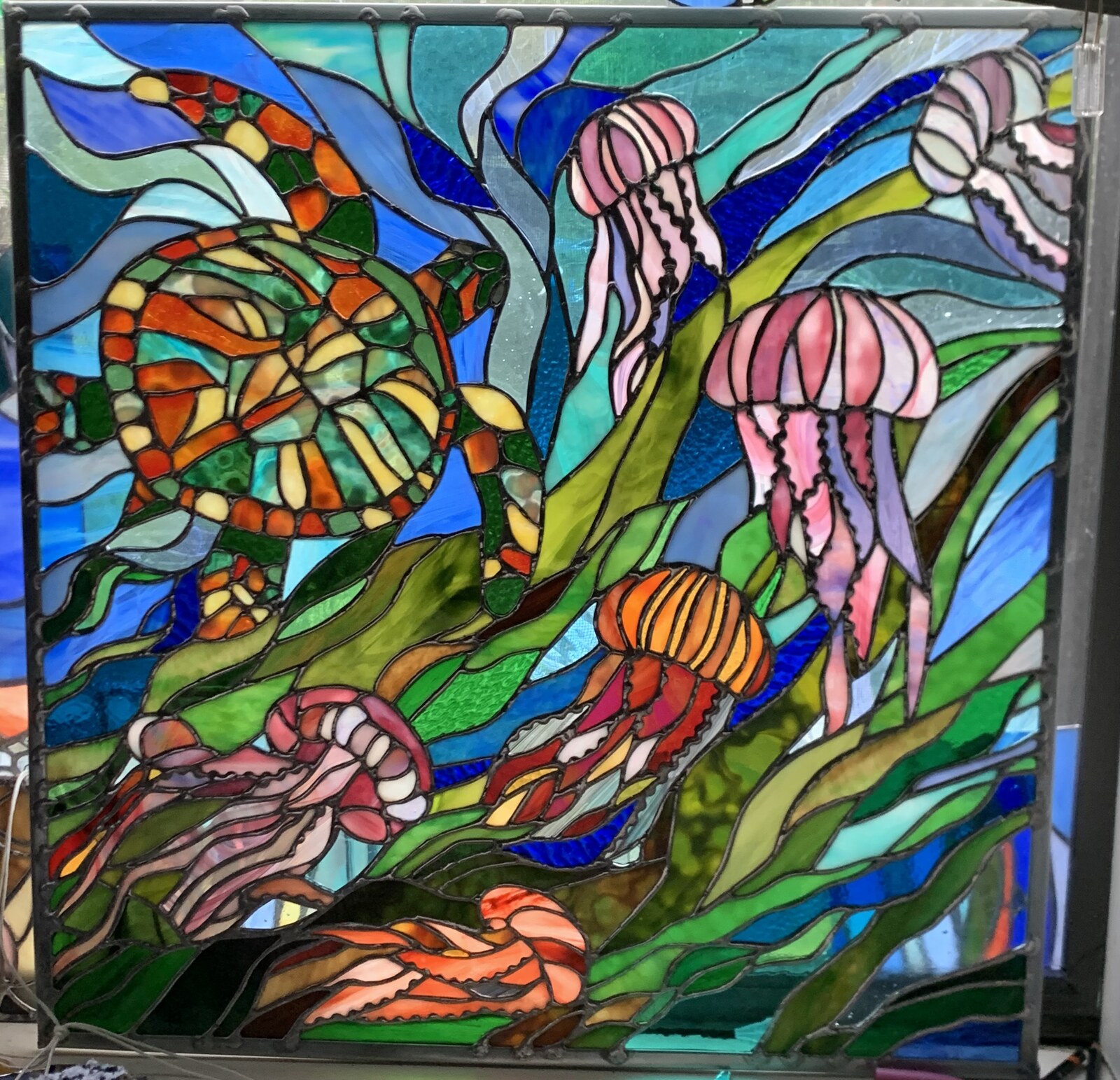 Detailed stained glass artwork from June Moon at Triangle Trading Post