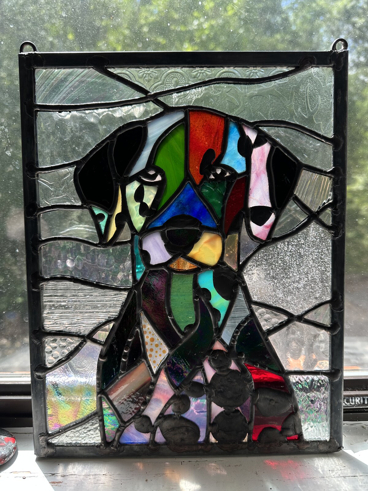 Stained glass portrait-style piece from June Moon at Triangle Trading Post