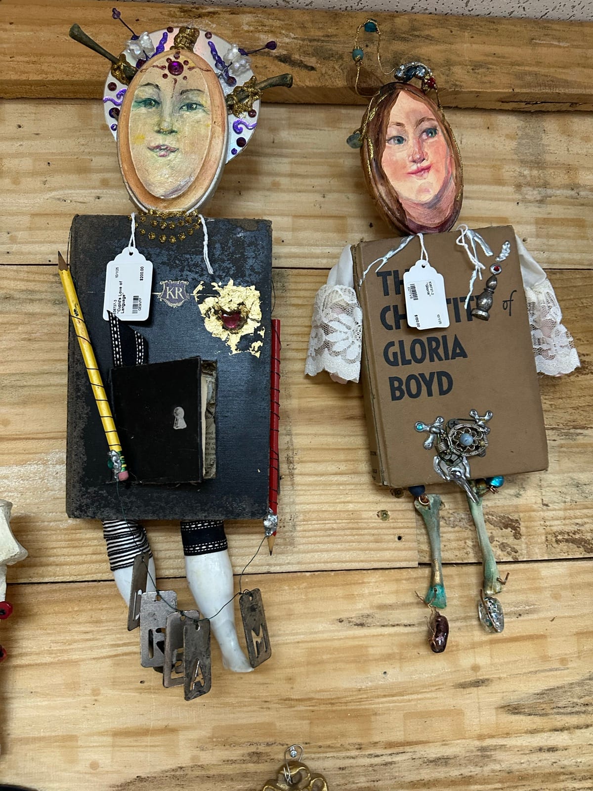 Mixed-media assemblage pieces with portraits and vintage objects by Adele Elliott