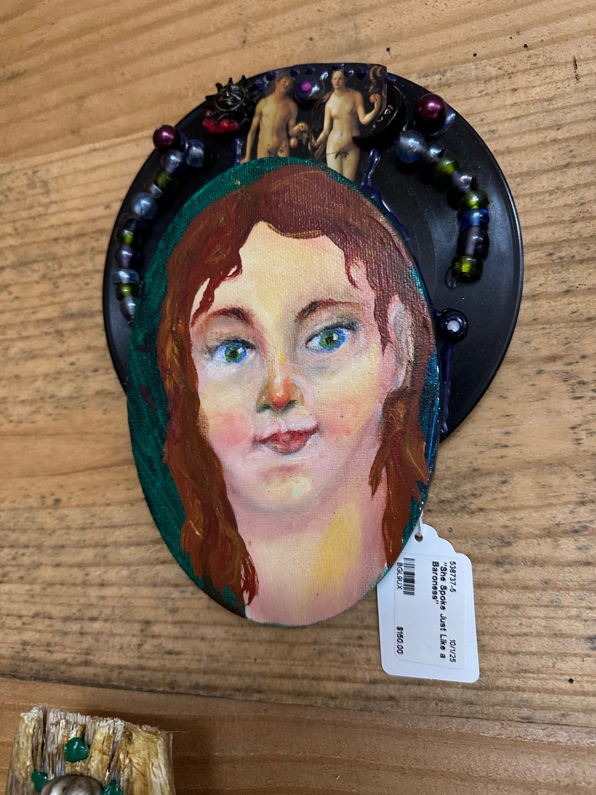 Painted portrait piece with beadwork by Adele Elliott