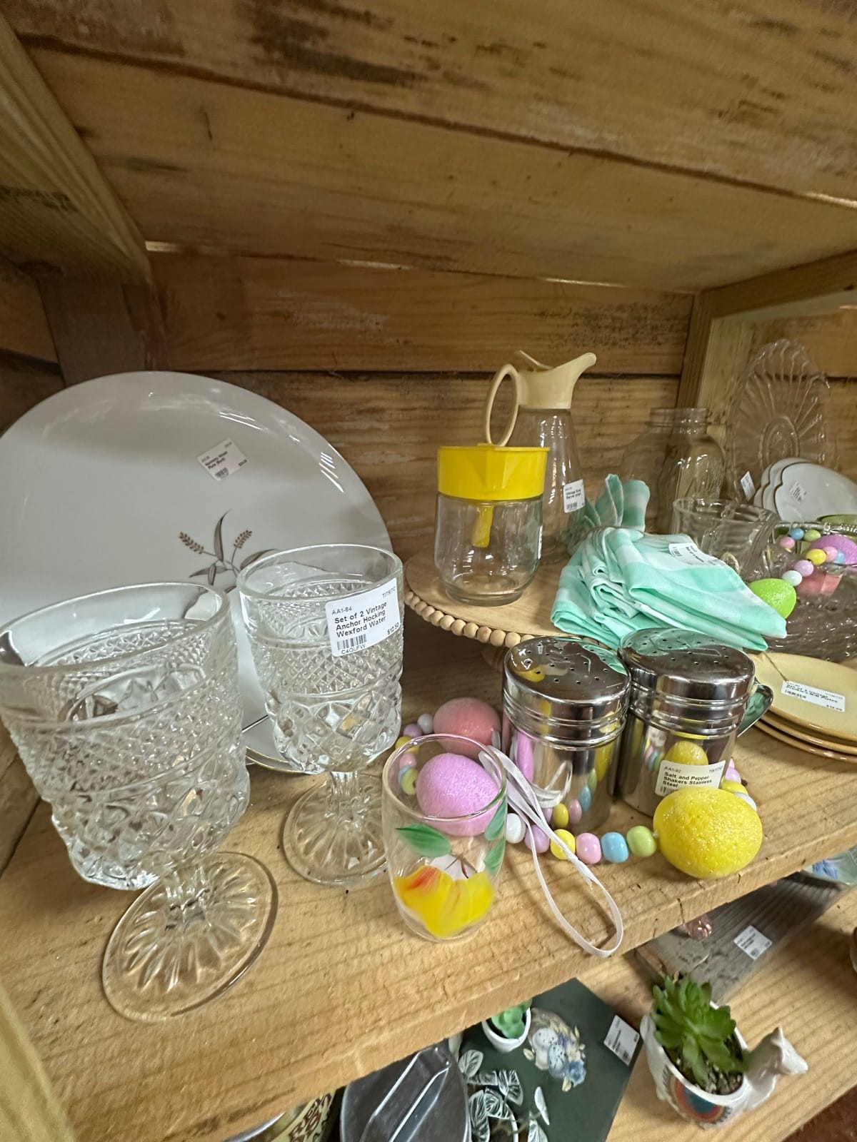 Amy's Attic booth with vintage crystal and glassware inside Triangle Trading Post