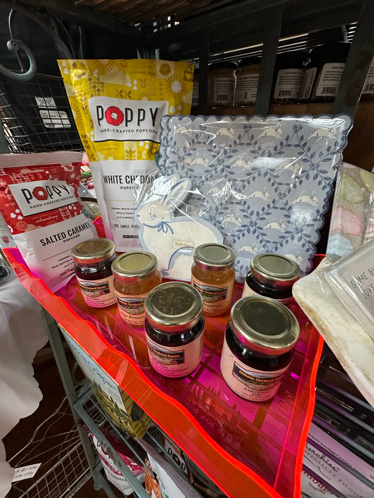 Poppy hand-crafted popcorn, jams, and packaged goods on display