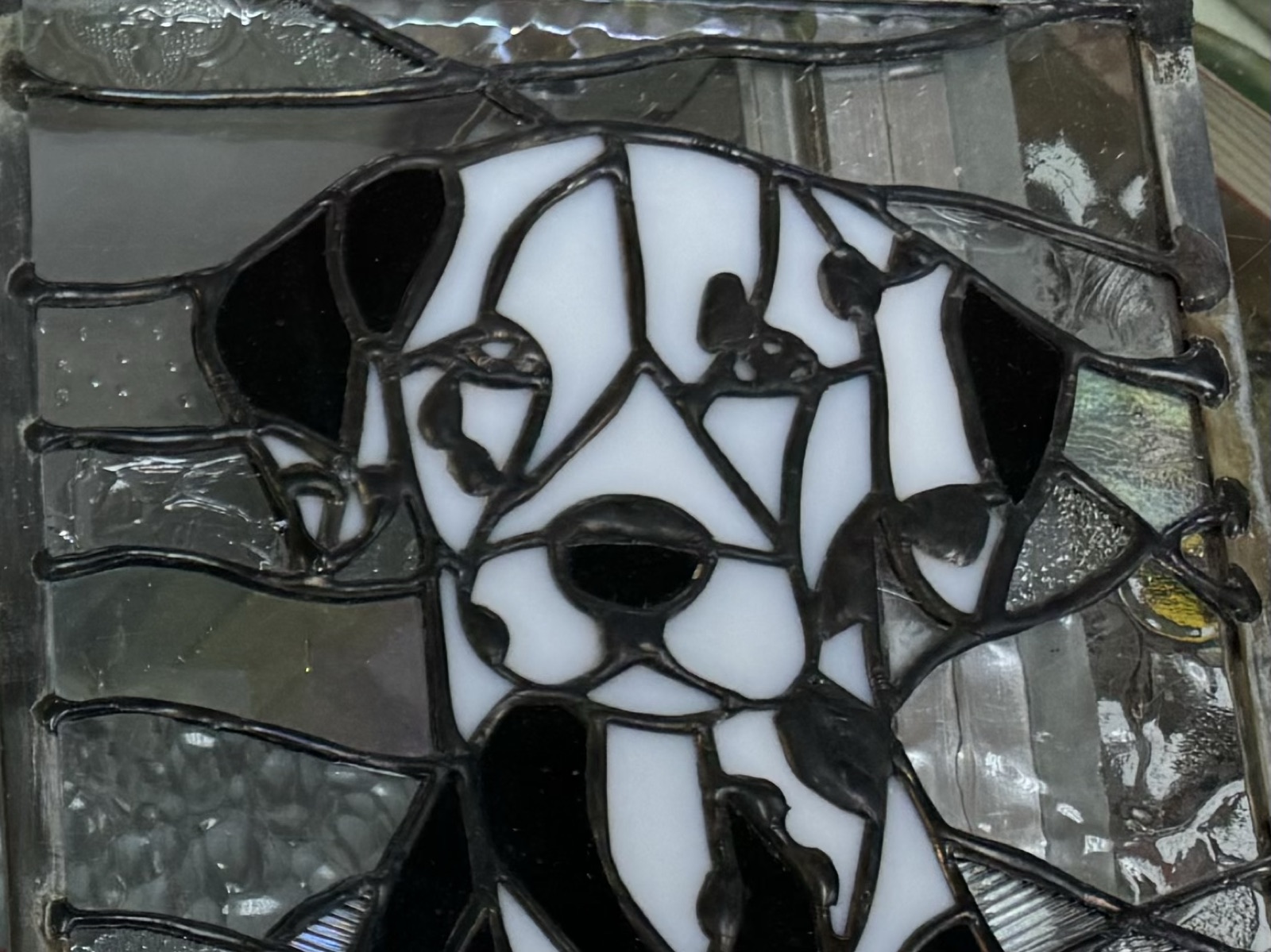Stained glass dog artwork made in a beginner class at Triangle Trading Post