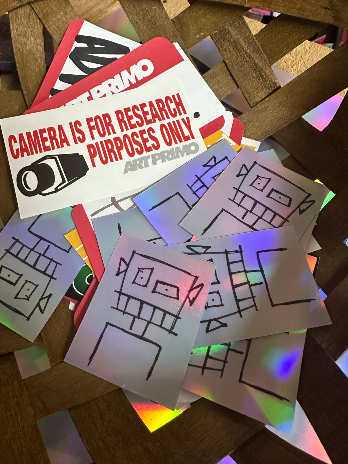 Collection of holographic art stickers and graphic prints