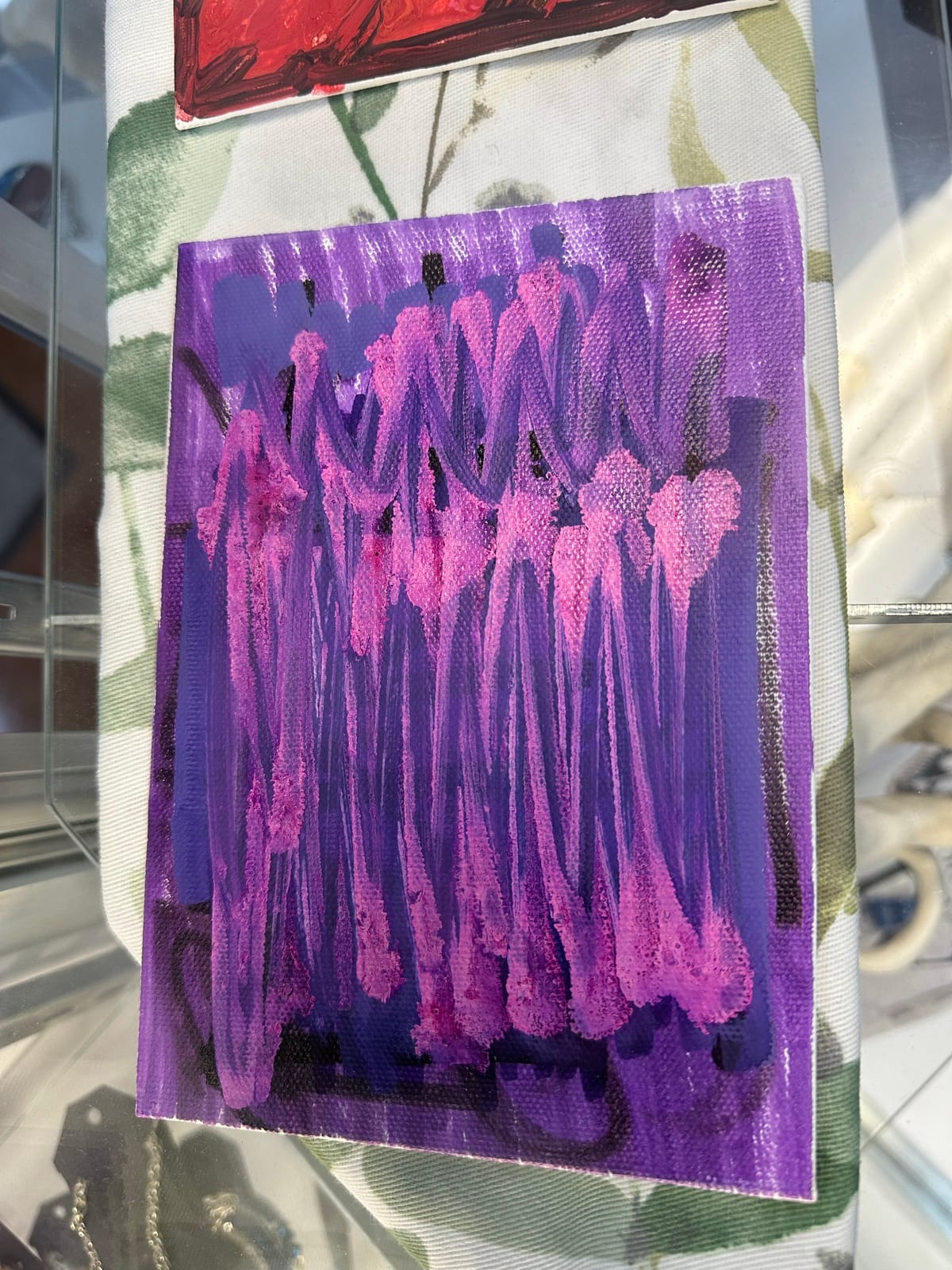Small abstract painting in purple and pink tones