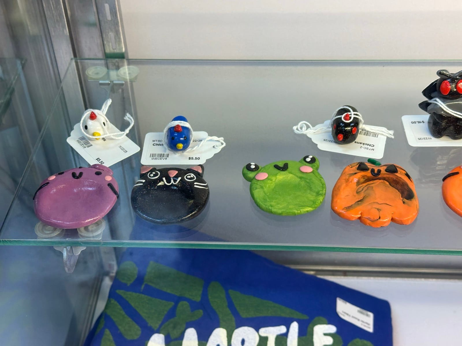 Handmade clay animal figures from More Than Sparrows Co inside Triangle Trading Post