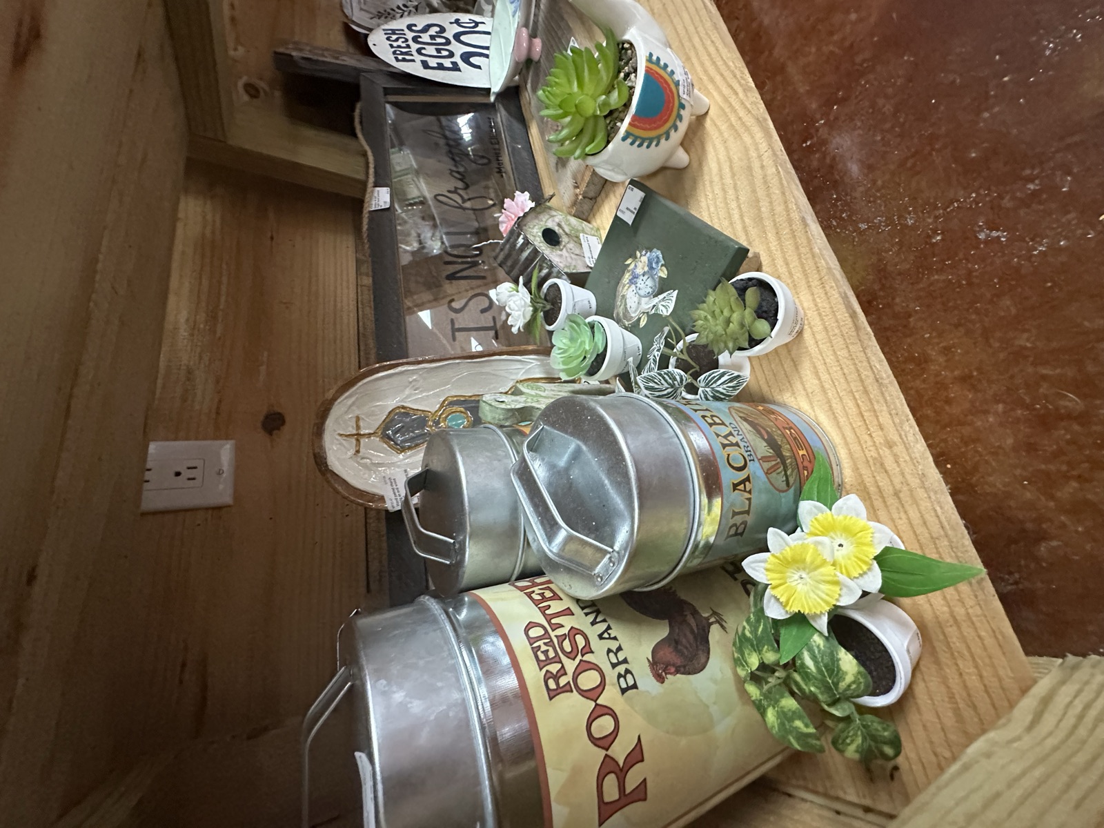 Metal planters, succulents, and rustic signage at MP Picks