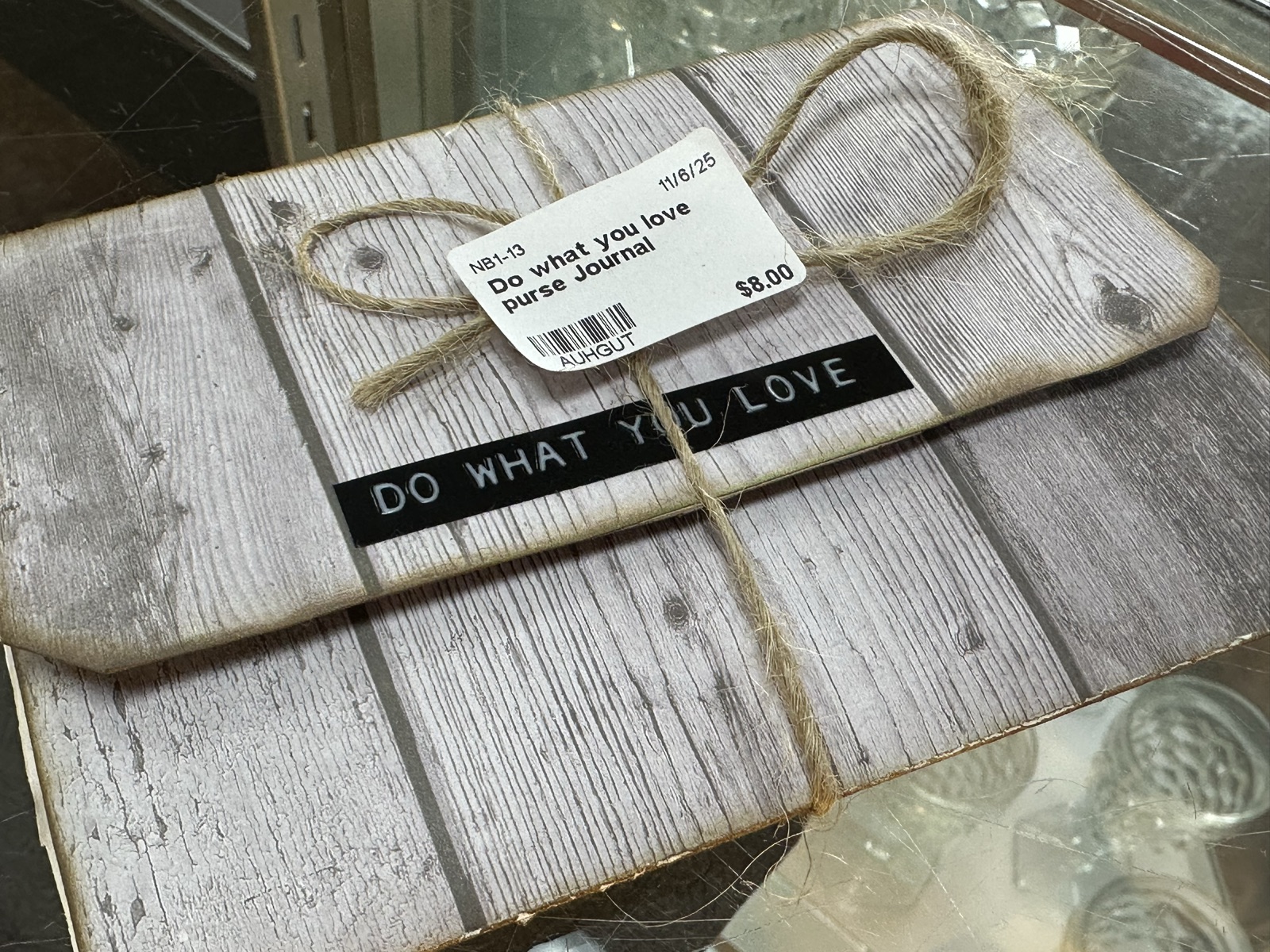 Rustic purse journal with wood-grain cover and twine closure