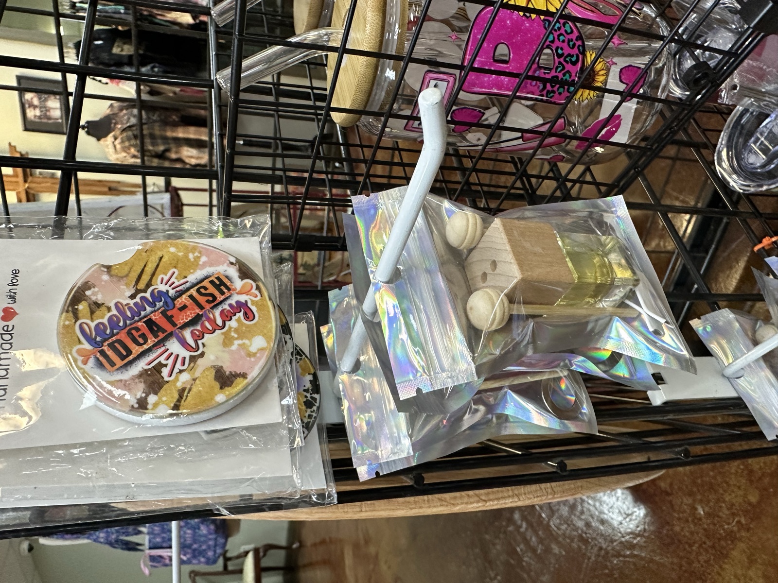 Packaged beaded accessories and holographic craft items on display