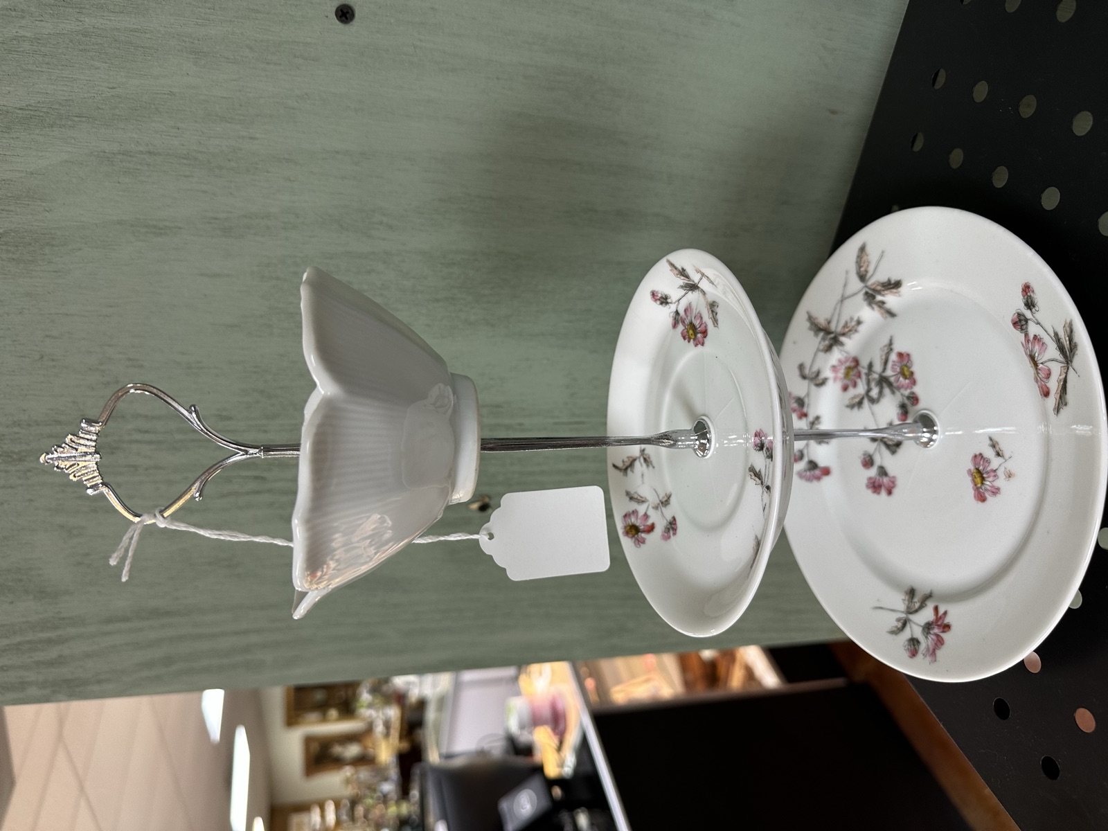 Three-tiered serving piece made from floral china plates with frosted glass bowl