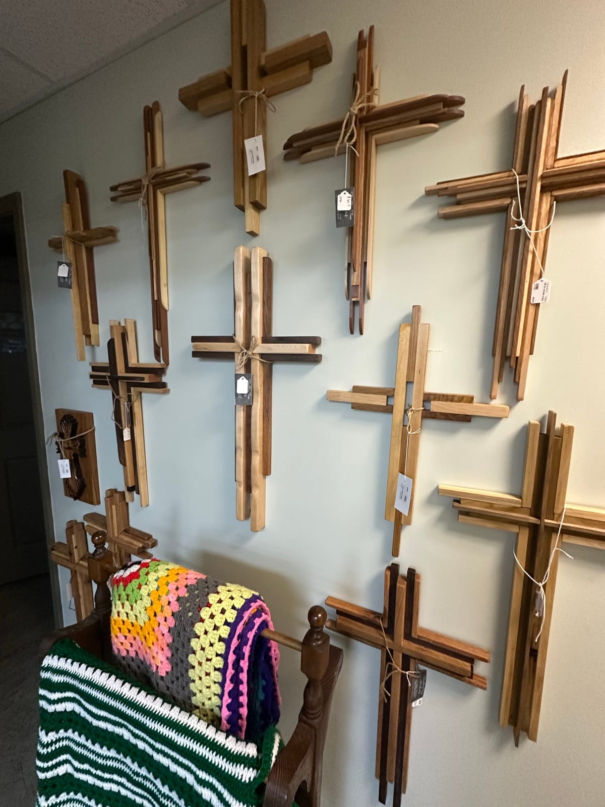 Handcrafted wooden crosses on display at Trembling Trees Wood Art