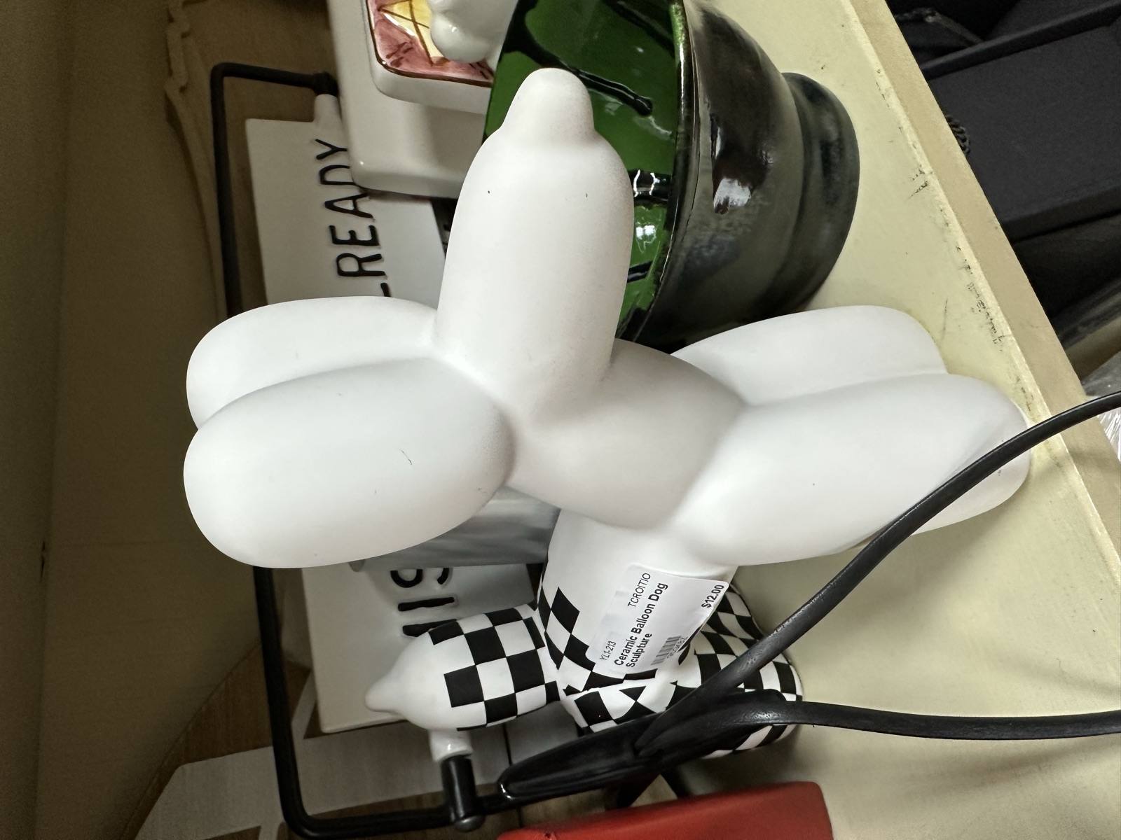 White balloon dog sculpture and collectible figures
